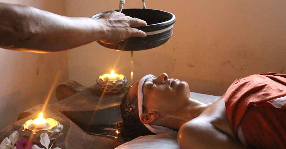 A relaxing Ayurveda spa treatment setup.